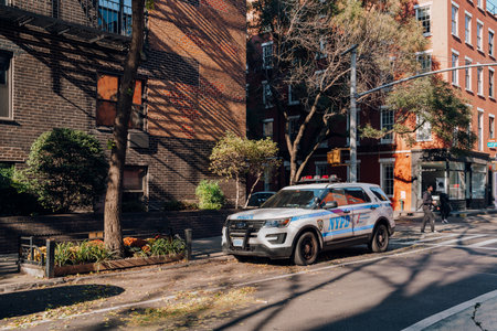 New York, USA - November 21, 2022: NYPD car parked on a street in Greenwich Village, New York City. NYPD is the largest and one of the oldest municipal law enforcement agencies in the United States.のeditorial素材