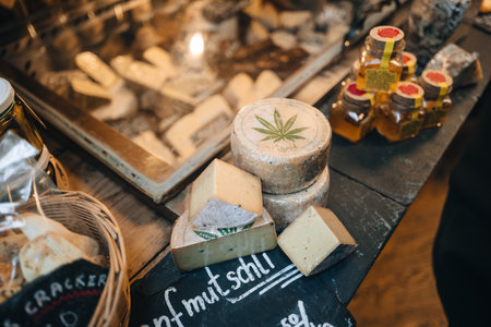 London, UK - January 27, 2023: Hanfmutschli hemp cheese on sale at Jumi stall inside Borough Market, one of the largest and oldest food markets in London.のeditorial素材