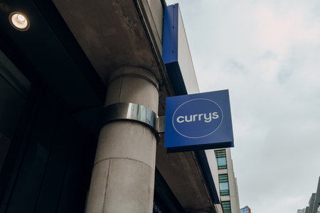 London, UK - February 02, 2023: Name sign outside Currys store in City of London. Currys is an...
