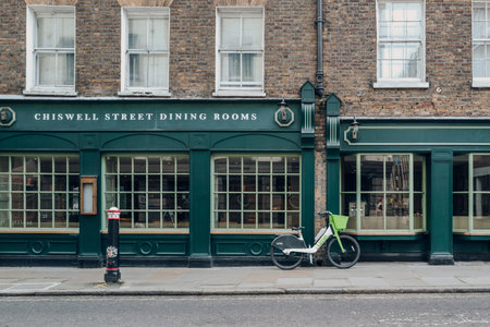 London, UK - February 02, 2023: Lime bike parked on a street in Barbican, London. Lime acquired the Jump e-bike and scooter business from Uber in May 2020.のeditorial素材