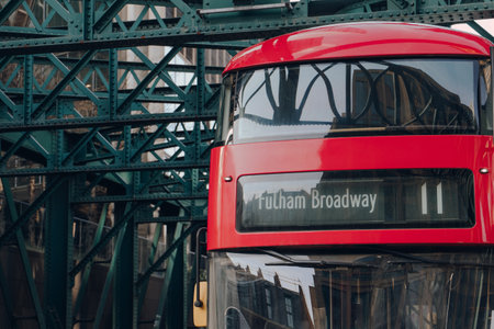 London, UK - February 09, 2023: Close up of Fulham Broadway destination on route 11 red double decker bus in London. Iconic red buses are an integral part of Transport for London network.のeditorial素材