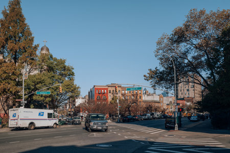 New York, USA - November 2021, 2022: Cars on the junction between West 8th and 6th Avenue in Greenwich Village, an area that is now a hub of popular cafes, bars and restaurants.のeditorial素材