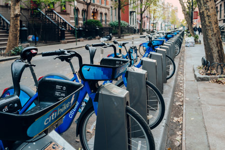 New York, USA - November 22, 2022: Close up of row of Citi Bikes parked at the docks on a street in Manhattan, New York. Citi Bike is a privately owned public bicycle sharing system serving the city.のeditorial素材
