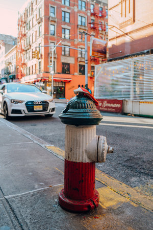 New York, USA - November 21, 2022: Fire hydrant painted in colours of Italian flag in Little Italy, a neighbourhood in Lower Manhattan in New York City, known for its large Italian population.のeditorial素材