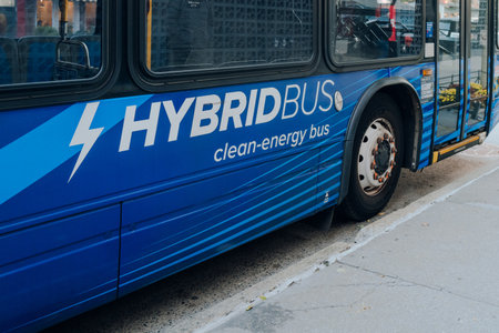 New York, USA - November 22, 2022: New York City Hybrid Bus on a street in Manhattan. There are currently 400 hybrid buses operating in the city.のeditorial素材