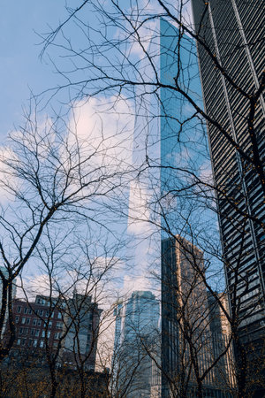 New York, USA - November 25, 2022: Sky and clous reflecting on a skyscraper in Financial District,  New York's financial heart and a home to Wall Street.のeditorial素材