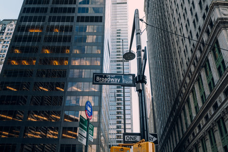 New York, USA - November 25, 2022: Street name signs on Broadway, a 13 mile-long road running from Financial District through the borough of Manhattan exiting north from New York City.のeditorial素材