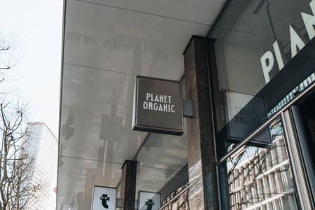 London, UK - April 13, 2023: Name sign at the entrance of Planet Organic store in Tottenham Court Road. Once UK's largest fully certified organic supermarket it has fallen into administration in 2023.のeditorial素材