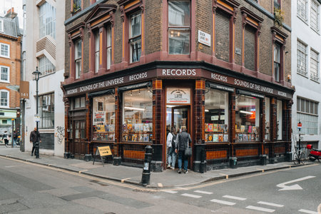 London, UK - April 13, 2023: People entering Sounds of the Universe record shop in Soho associated with Soul Jazz Records, an independent record label.のeditorial素材