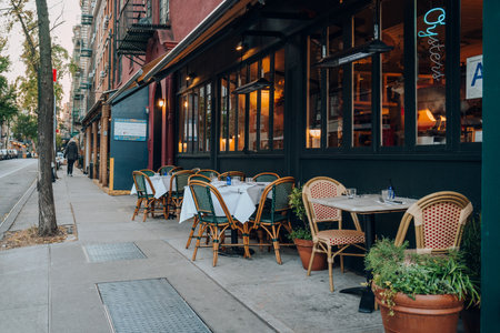November 23, 2022 - New York, USA: Outdoor tables of a restaurant in Greenwich Village, an area that is now a hub of popular cafes, bars and restaurants.のeditorial素材