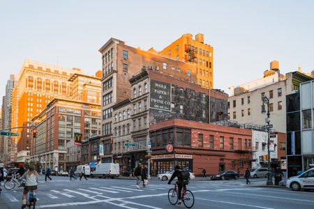 November 23, 2022 - New York, USA: Pedestrian and cyclists on Sixth Avenue, also known as Avenue of the Americas, a major thoroughfare in Manhattan that is commercial for much of its length.のeditorial素材
