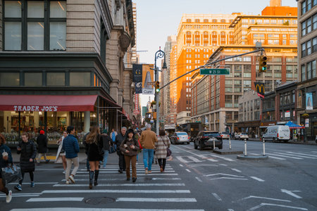 November 23, 2022 - New York, USA: View of Sixth Avenue, also known as Avenue of the Americas, a major thoroughfare in Manhattan that is commercial for much of its length. People walk in front.のeditorial素材