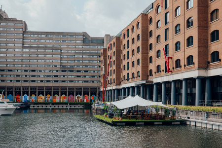 London, UK - July 06, 2023: View of Cloister Walk in St Katharine Docks, a former dock and now a mixed-used district and London's only marina in Central London.のeditorial素材