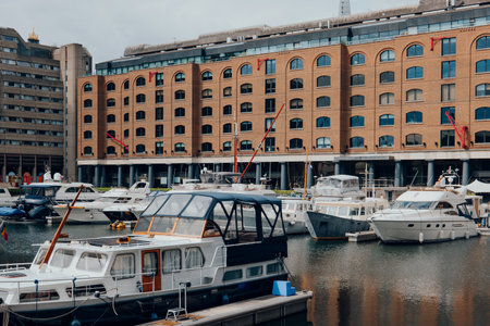 London, UK - July 06, 2023: Boats and yachts moored in St Katharine Docks, a former dock and now a mixed-used district and London's only marina in Central London.のeditorial素材