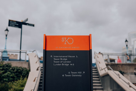 London, UK - July 06, 2023: Close up of a directional sign in St Katharine Docks, a former dock and now a mixed-used district and London's only marina in Central London.のeditorial素材