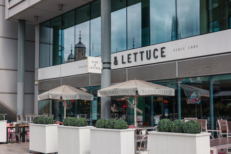 London, UK - July 06, 2023: Slug and Lettuce bar and restaurant in St Katharine Docks, a former dock and now a mixed-used district and London's only marina in Central London.のeditorial素材
