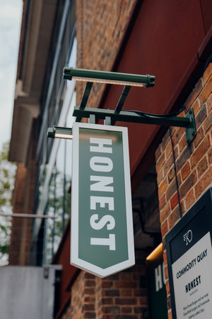 London, UK - July 06, 2023: Sign outside Honest Burgers, a British burger restaurant chain first opened in Brixton in 2011.のeditorial素材