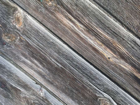 Background with texture of old wood. Diagonal arrangement of boards.の写真素材
