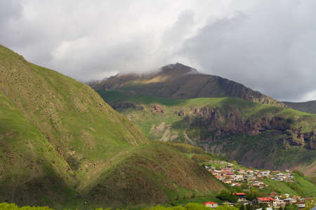 View of mountains covered with green vegetation on a cloudy summer day, Georgiaの写真素材