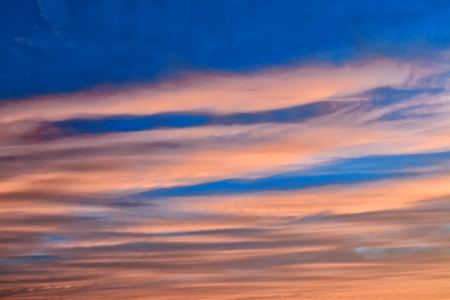 Blurred background. Bright sky with fluffy clouds.