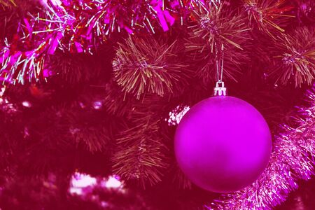 Blurred background. Christmas tree decorated with bright toys. greeting cardの写真素材
