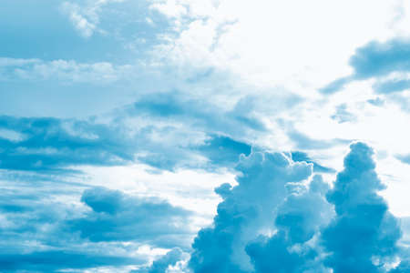 Blurred background. Blue sky and white fluffy clouds.