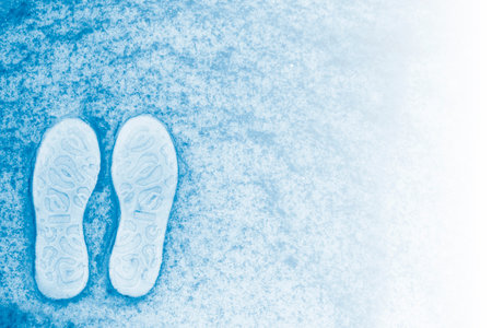 Shoe marks on white snow. Human Footprints In The Snow.の写真素材