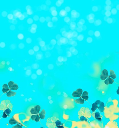 Green clover leaves on a background summer landscape. St.Patrick's Day
