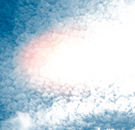Blurred background. Blue sky and white fluffy clouds.の写真素材