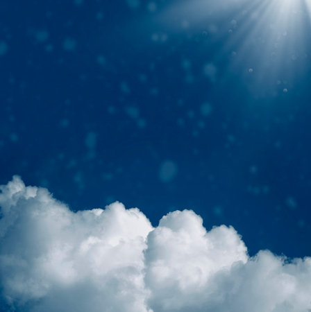 Blurred background. Blue sky and white fluffy clouds.