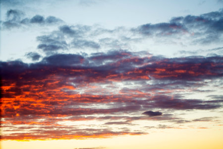 Blurred background. Blue sky and white fluffy clouds.の写真素材