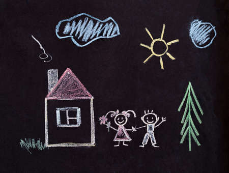 Childrens drawing with crayons. Happy family near the house around the beautiful natureの写真素材