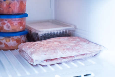 Frozen food in the freezer. Products for the winter in the refrigerator