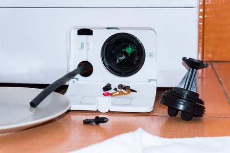 Service of the washing machine, got a small garbage from the filterの写真素材