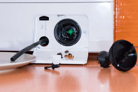 Service of the washing machine, got a small garbage from the filterの写真素材