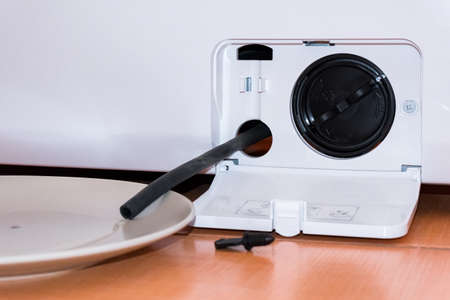 Service of the washing machine, the filter with a tube, water poursの写真素材