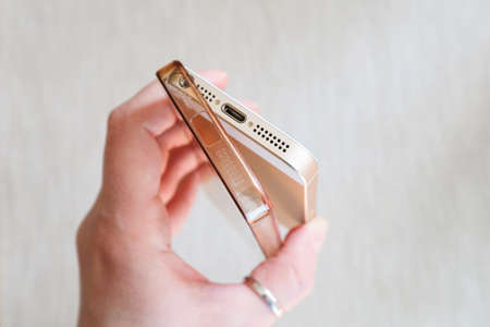 Silicone case for smartphone bent in his handの写真素材