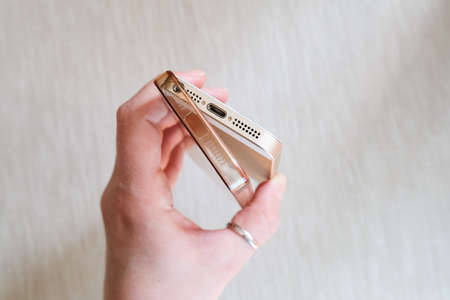 Silicone case for smartphone bent in his handの写真素材