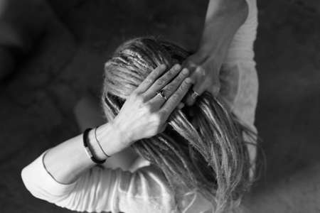 Beautiful hands. Weave dreadlocks. African hairstyle. Top viewのeditorial素材