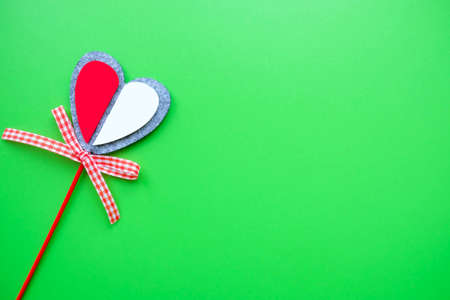 Valentine card on a green background. Heart on a stick.の写真素材