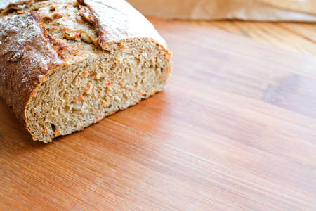 Bread on a cutting board. Diet product. Cut pieceの写真素材