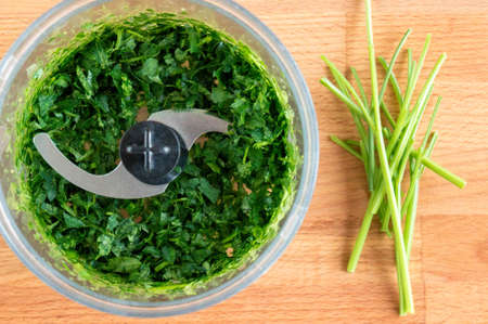 Parsley in a blender. Finely chop the greens quicklyの写真素材