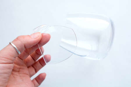 Hold a piece of broken glass in your hand. View from aboveの写真素材