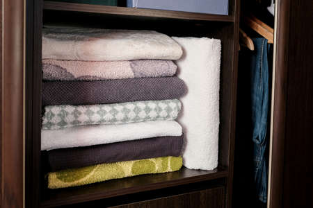 Terry towels are on the shelf in the closetの写真素材