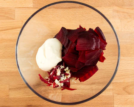 Boiled beets with mayonnaise and garlic in a salad bowl.の写真素材