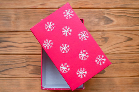 Red box with white snowflakes. Gift wrap