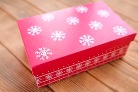 Festive christmas box with closed lid. White snowflake printの写真素材
