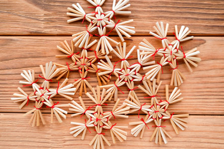 There are many straw snowflakes in the center. Christmas tree decorationsの写真素材