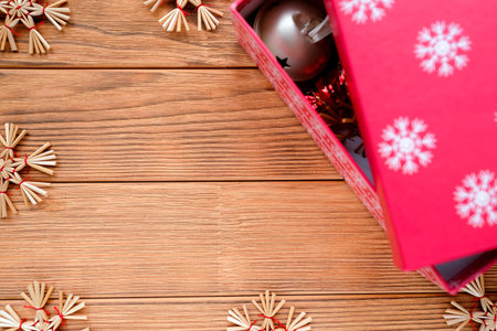 Festive card with place for text. Red box, straw snowflakesの写真素材