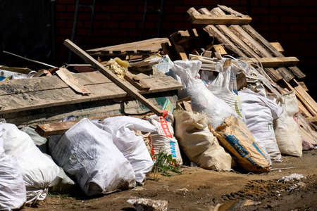 Rubbish from building and renovating a house. Used materials are lying on the street.のeditorial素材